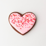 Vanilla and chocolate heart-shaped sugar cookies with red, pink and white royal icing and sprinkles